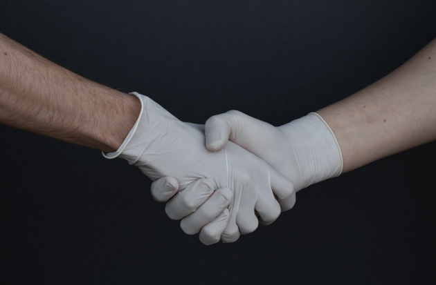 Handen schudden handschoen